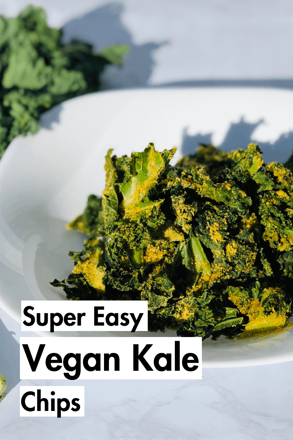 Alt tag These cheesy vegan kale chips are seriously delicious and SO easy to make. Great for plant based snacks. They are tasty AND healthy. #vegan #vegancooking #plantbased